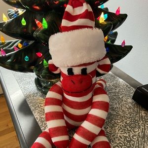 Candy Cane colored handmade sock monkey with removable hat.